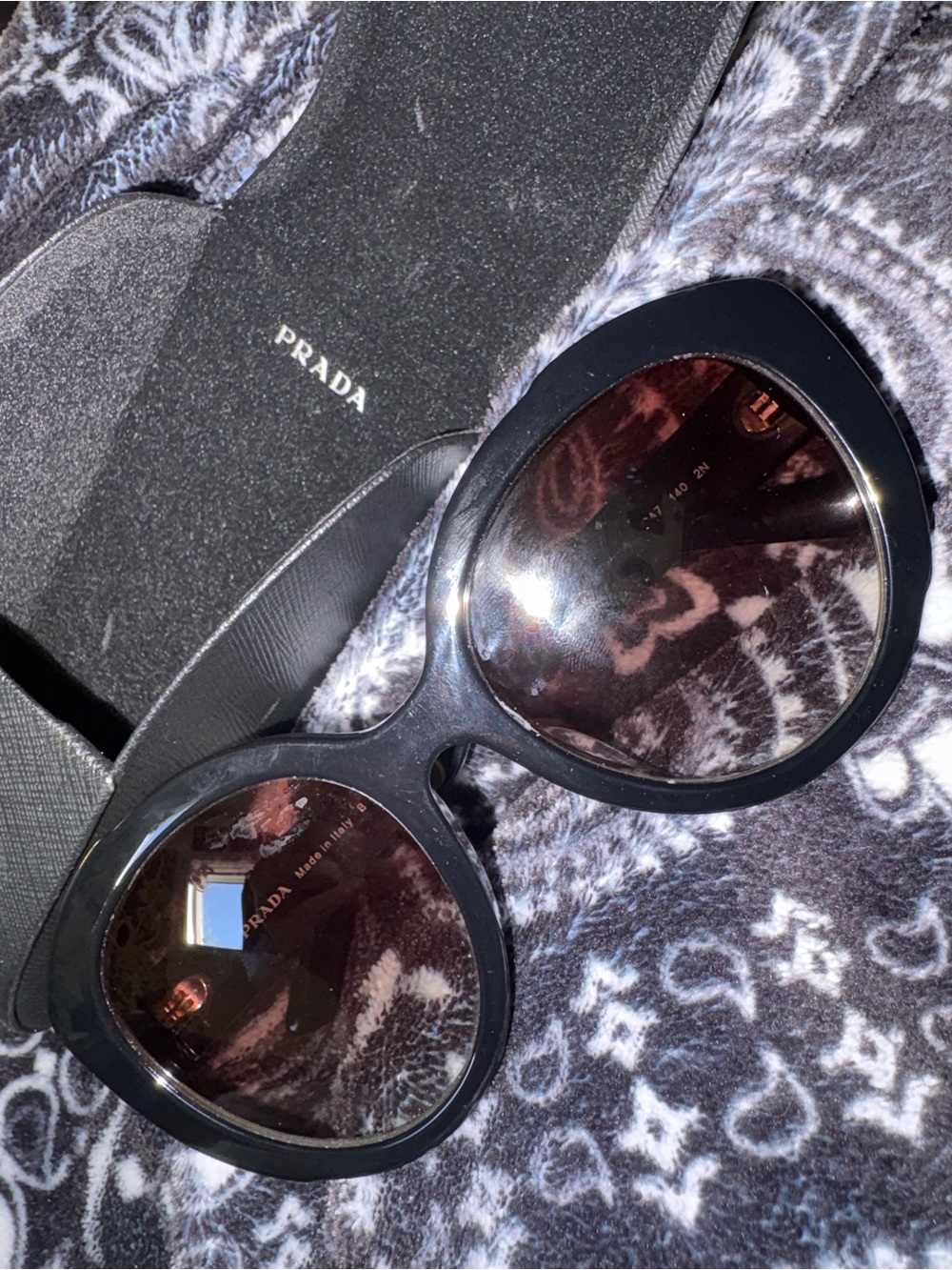 Prada Black Frame Sunglasses with Brown Tinted Lenses